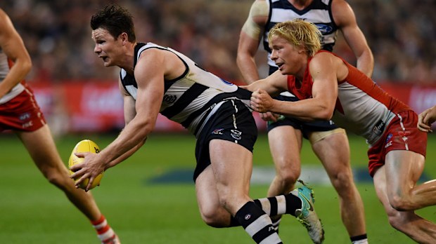 The Cats' Patrick Dangerfield tries to get the ball away in last night's loss to Sydney.(AAP)