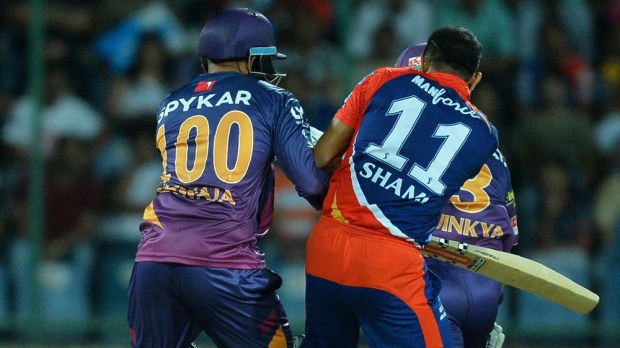 Usman Khawaja collides with Mohammed Shami. (AAP)
