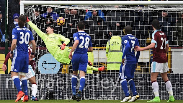 Chelsea's goalkeeper Thibaut Courtois cannot prevent Robbie Brady's freekick in their draw against Burnley. (AFP)