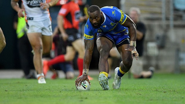 Parramatta winger Semi Radradra crosses against Wests Tigers. (AAP)
