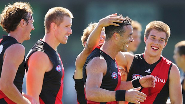 Ryan Crowley (second from right) with his new Bombers teammates. (Getty)