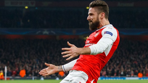 Olivier Giroud celebrates after scoring in Arsenal's Champions League match. (AAP)