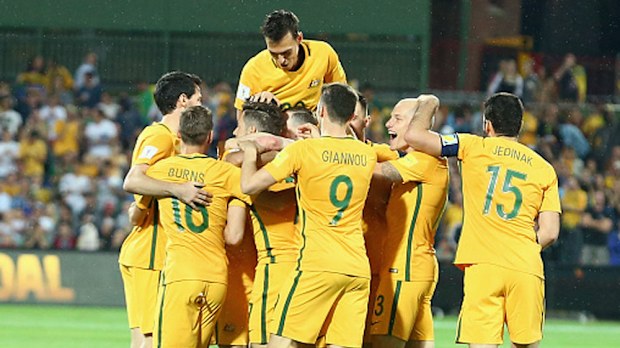Socceroos players celebrate a goal against Tajikistan.(Getty)