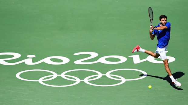 The French tennis squad, including Gilles Simon (pic), has been shattered by the death of Patrick Bordier. (AFP)
