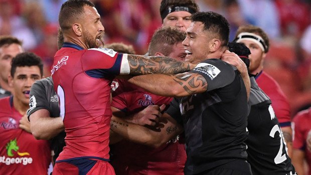 Reds five-eighth Quade Cooper and Crusaders player Codie Taylor. AAP) 