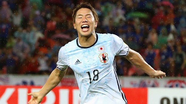 Takuma Asano scores in Japan's 2-0 win over Thailand. (AAP)