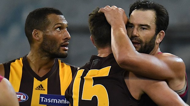 Hawthorn's Josh Gibson (l), Luke Hodge and Melbourne's Jordan Lewis.