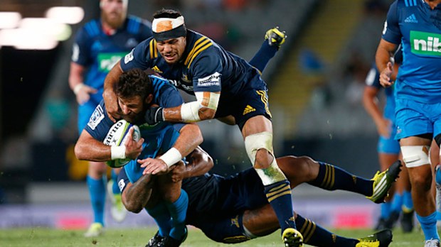Billy Guyton of the Blues is tackled during their win over the Highlanders. (Getty)
