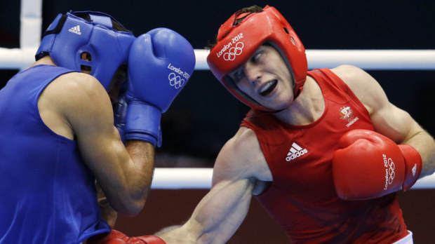 Abderrazak of Tunisia, left, and Jeffrey Horn of Australia, fight during the men's light welterweight boxing competition at the 2012 Summer Olympics. (AAP)
