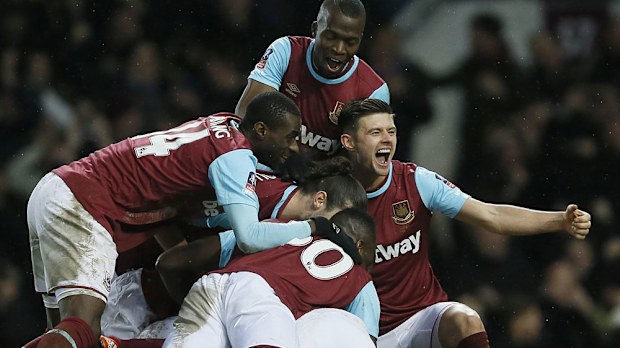 The Hammers celebrate Angelo Ogbonna's winner. (AAP)