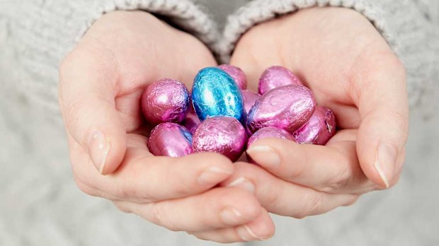 Hands holding Easter eggs