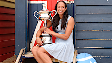 Madison Keys of the United States poses with the Daphne Akhurst Memorial Cup at the Brighton Bathing Boxes.