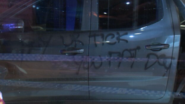 A threatening message was spray painted on the side of the ute.