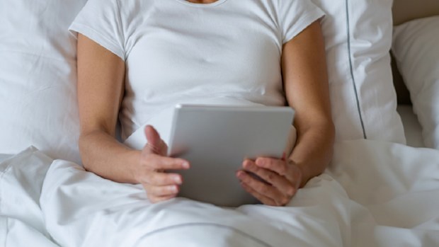Woman in hotel bed
