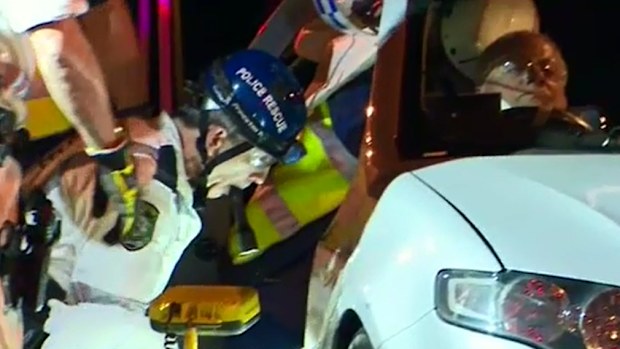 The taxi driver was trapped for almost an hour. (9NEWS)