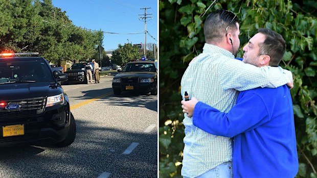 Police attend the scene of the shooting; coworkers of the slain comfort one another. (AP)