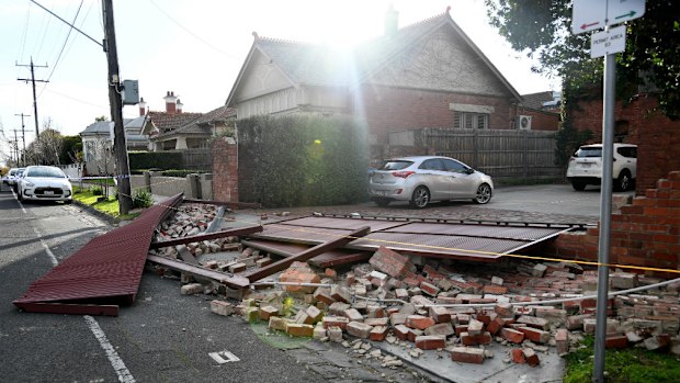Police block off Kent St after parts of a brick wall and garage door were blown over by high winds in Travancore on July 29. (AAP)