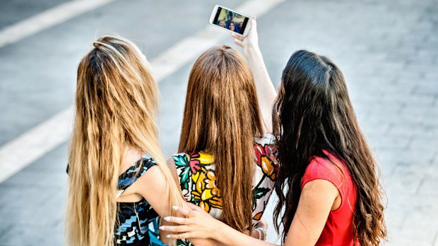 Taking a selfie can increase your chance of head lice, a study has found. (iStock)