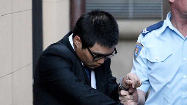Tai Jin Park is led by a Corrective Service Officer to a waiting prison van at NSW Supreme Court in Sydney, Friday, June 30, 2017. (AAP)