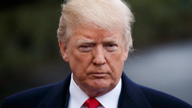 US President Donald J. Trump pauses to deliver remarks as he walks to board Marine One on the South Lawn of the White House in Washington, DC, USA on February 23, 2018. (AAP)