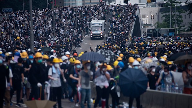 An ambulance aids injured protesters after confrontation with the riot police during the demonstration. 