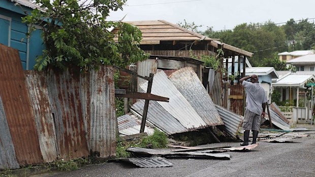 A man surveys the wreckage on his property after the passing of Hurricane Irma, in St. John's, Antigua and Barbuda. (AAP)
