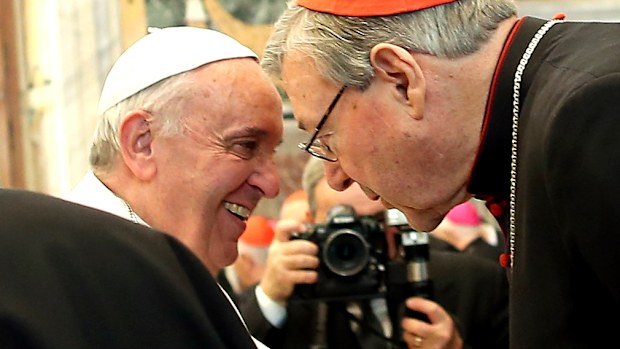 Pope Francis exchanges Christmas greetings with Cardinal George Pell. (Getty Images)