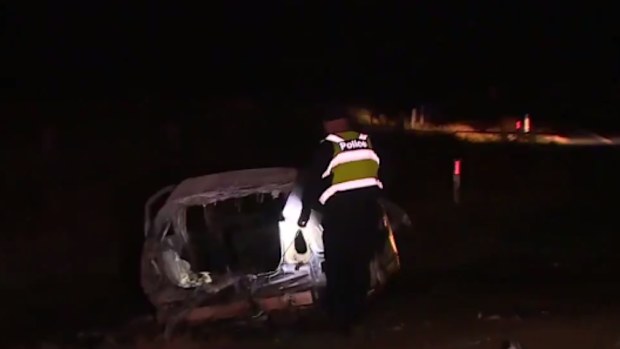 The driver's car caught fire after crashing into a mount of dirt, police said. (9NEWS)