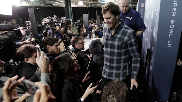 Tom Brady, 40, is swarmed by the media in the lead up to Monday's game. (AAP)
