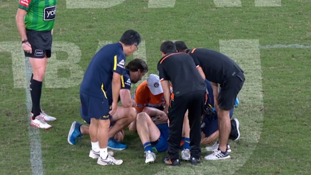 Tom Opacic lays injured on the ground.