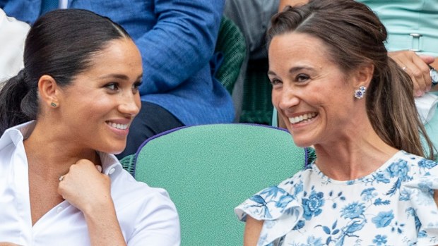 Catherine, Duchess of Cambridge and Meghan, Duchess of Sussex and Pippa Middleton in the Royal Box at Wimbledon on July 13, 2019 in London, England.