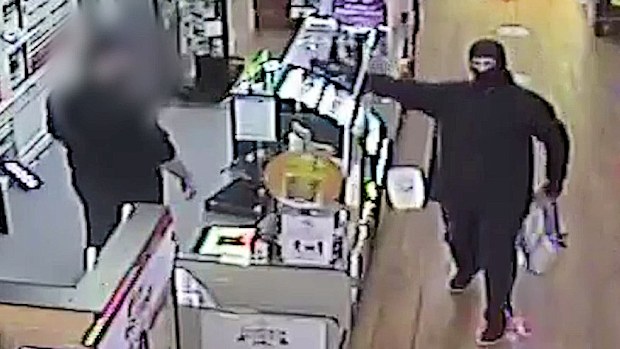 Upon leaving the store, the armed offender proceeds to point the taser within metres of the staff members face for several seconds before running out of the store. 