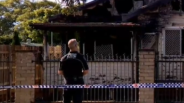 A nine-year-old boy is dead and a woman is under police guard after a suspicious house fire in Toowoomba, Queensland. 