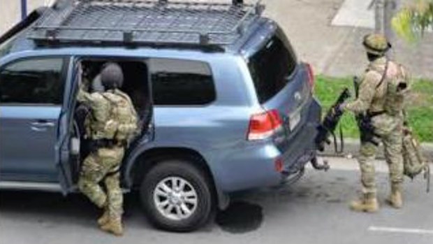 Heavily-armed police at the scene of the siege. (9NEWS)