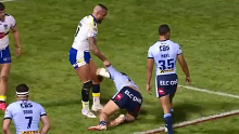 Paul Vaughan attempts to pull Sione Mata'utia to his feet in the Super League.