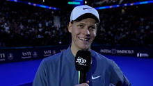 Jannik Sinner blushes while being serenaded by the ATP Finals crowd.