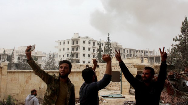 Members of a Syrian opposition group are seen after they attacked the Military Academy of the Assad regime forces with missiles in west Aleppo city, Syria on October 29, 2016. (AFP)