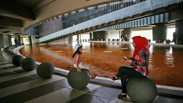 A woman and her daughter at the Tsunami Museum in Banda Aceh. (AAP)