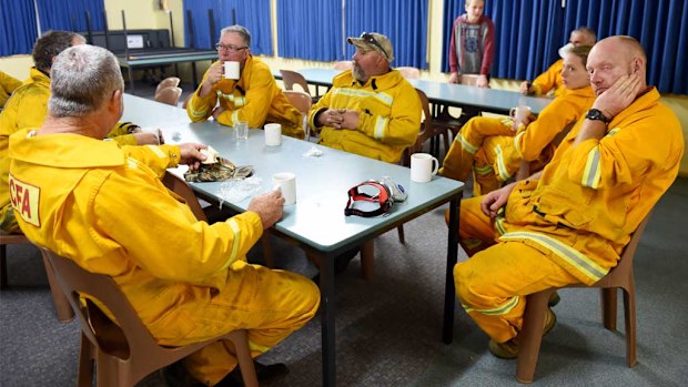 CFA fire fighters rest as they watch a spot fire near a property in Benloch in October. (AAP)
