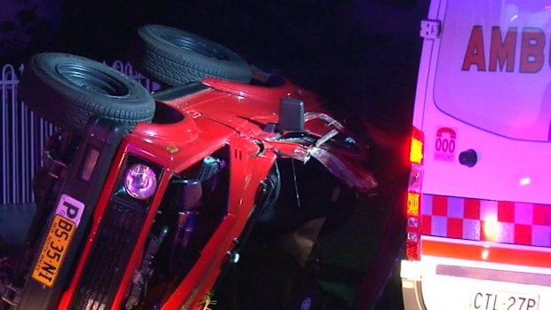 A man has been hurt after his car rolled overnight in Sydney. (9NEWS)