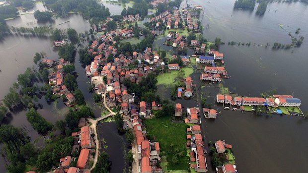 An aerial view of waters flooding Xinhua Village of Xinchang county in Wuhan city, Hubei Province (AAP)
