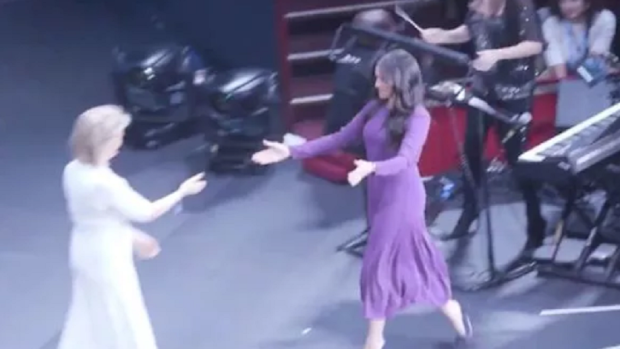 The Duchess approached the charity co-founder with arms outstretched.