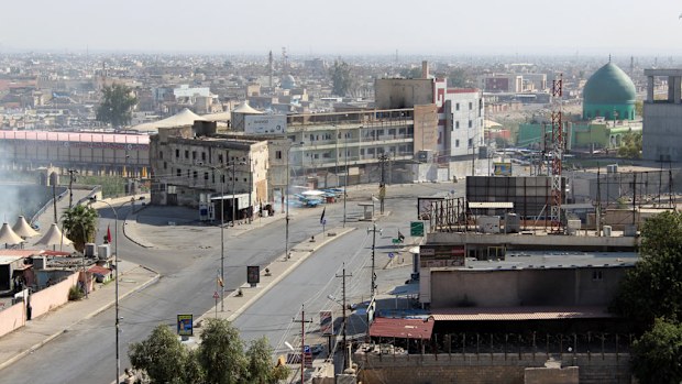  Iraqi security forces clash with Daesh terrorists near the former police headquarters after Daesh attacks in Kirkuk, Iraq on October 21, 2016. (AFP)