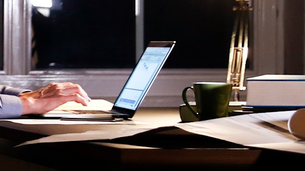 Man using computer at night