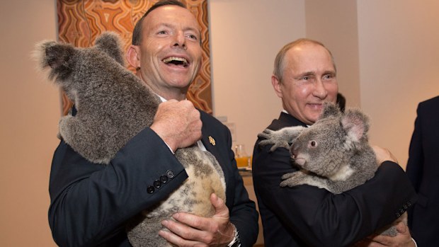 Australian Prime Minister Tony Abbott cuddles up to a koala with Russia's President Vladimir Putin showing his softer side. (Getty Images)