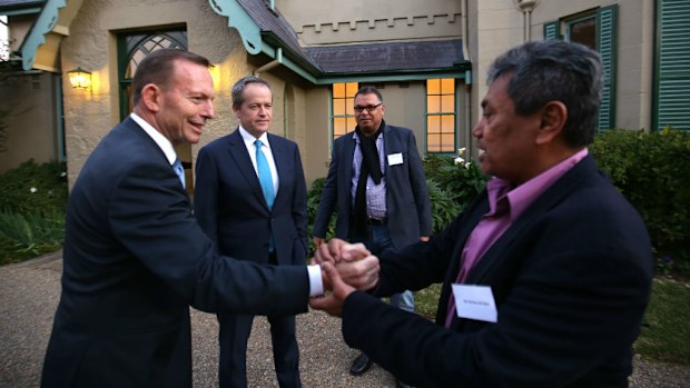 Tony Abbott and Bill Shorten greet guests including Richie Ahmat (R) and Sean Gordon (background/right) at Kirribilli House ahead of NAIDOC Week. (AAP)