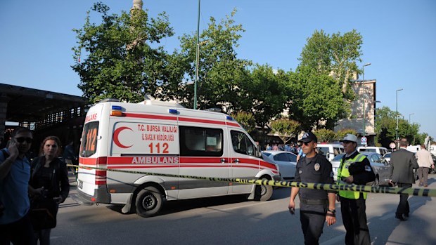 Police officers secure the area after a suicide bomb explosion outside the historical Ulu Cami in Bursa, Turkey, Wednesday. (AAP)