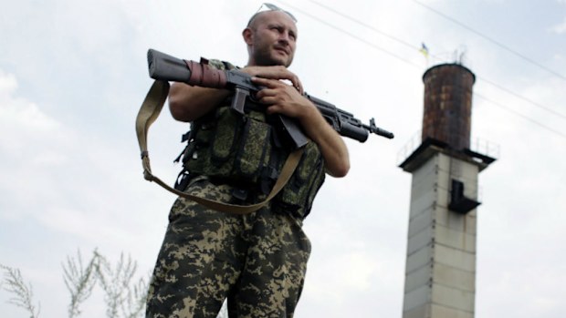 A Ukrainian soldier stands guard at a check-point near the eastern Ukrainian city of Donetsk. (Getty Images)