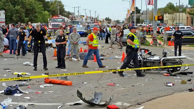 A car has ploughed through a US university parade, killing three people. (AAP)