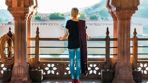 She is at a public viewpoint, accessible without entry fee